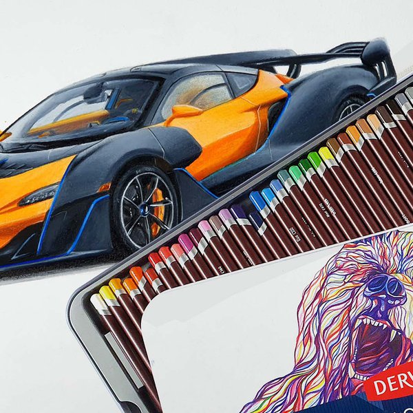 a drawing of an orange mclaren sabre half covered with a box of derwent coloursoft colore dpencils
